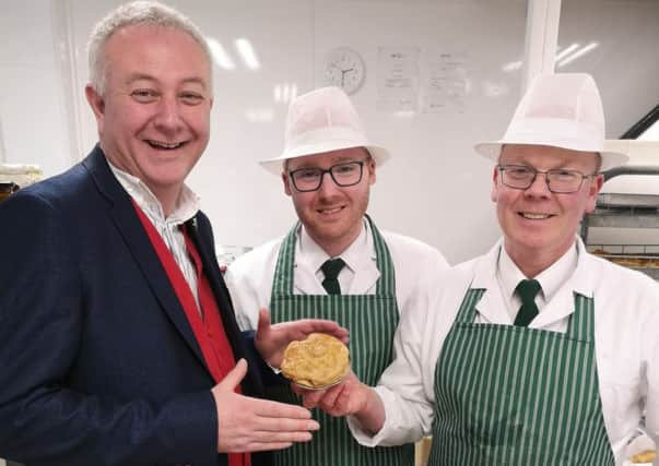 One of last year's guest judges, auctioneer Colin Young, pictured visiting Woolliss & Son in Louth. (Picture: Louth Pie Day)