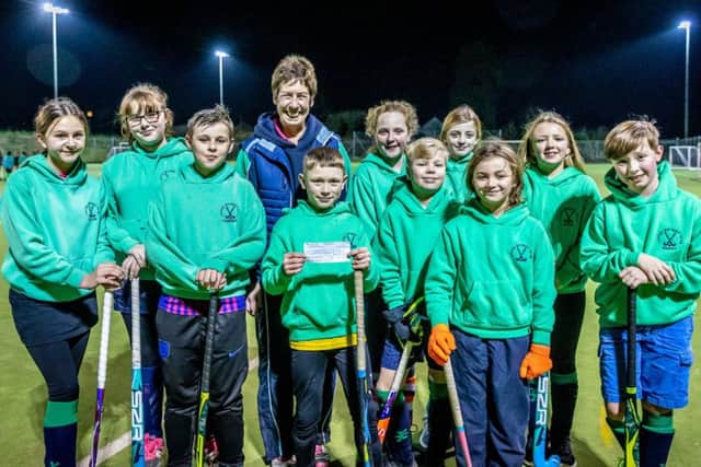 Louth Hockey Club members with the cheque.