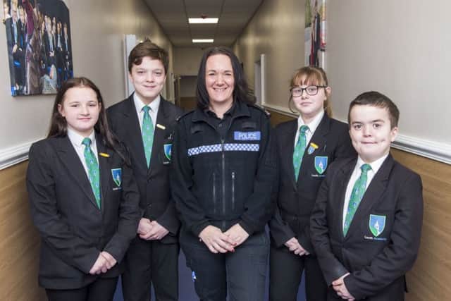PC Mel Standbrook with Year 8 students Mollie Wilkinson, Elliott Barton, Alex Martin and Lennon Dovey. (Picture: Sean Spencer/Hull News & Pictures Ltd.)
