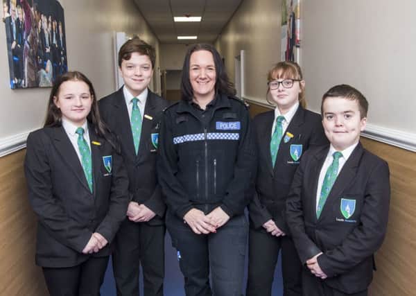 PC Mel Standbrook with Year 8 students Mollie Wilkinson, Elliott Barton, Alex Martin and Lennon Dovey. (Picture: Sean Spencer/Hull News & Pictures Ltd.)