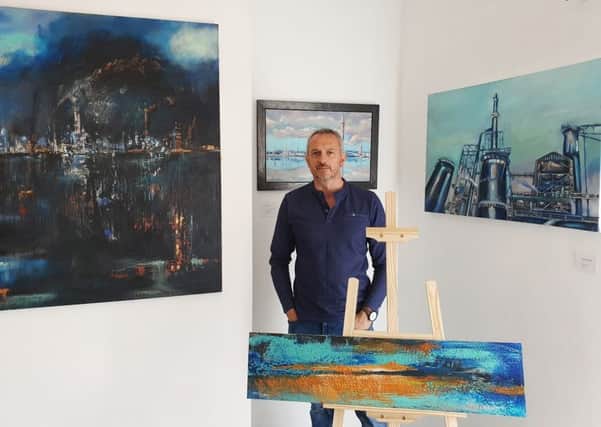 Chris Beasley with some of his own artwork at the gallery in Aswell Street.