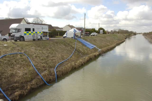 Police divers searching the South Forty Foot Drain at Swineshead.