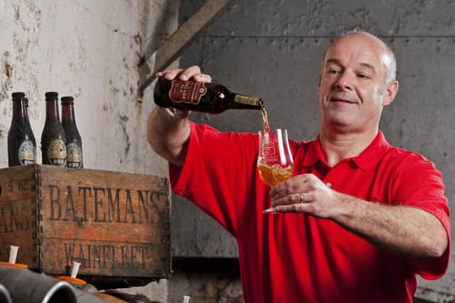 Stuart Bateman pours a glass of his brewery's Vintage Ale. Photo: Batemans