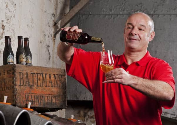 Stuart Bateman pours a glass of his brewery's Vintage Ale. Photo: Batemans