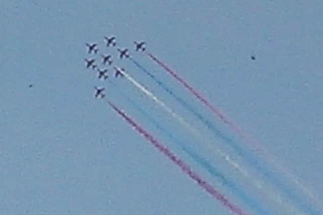 Red Arrows fly past
