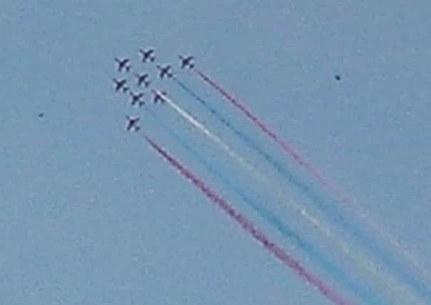Red Arrows fly past