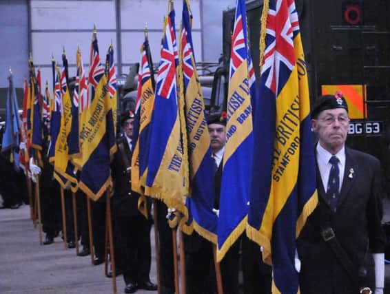Standard bearers at the ceremony on Sunday. Photo by David Nutt.