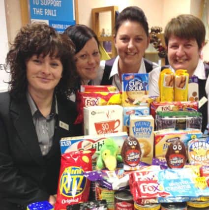 Louth's branch of the Norwich and Peterborough Building Society collect food for Louth Community Larder.
