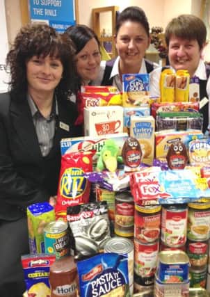 Louth's branch of the Norwich and Peterborough Building Society collect food for Louth Community Larder.