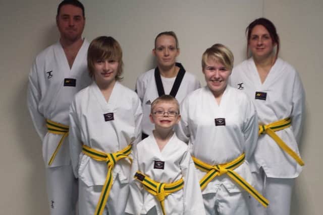 Taekwondo grading: Nathan Cartwright, Ryan Cordwell, Instructor Melissa Ball 2nd Dan, Hayden Cartwright, Kirsty Cordwell and  Ali Blakely. EMN-140331-073721001