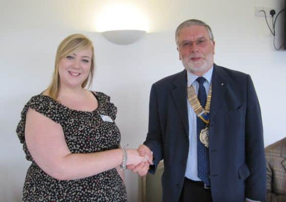 Rotary president Derek Anderson and Hospice fundraiser Lauren Alexander EMN-140331-081925001