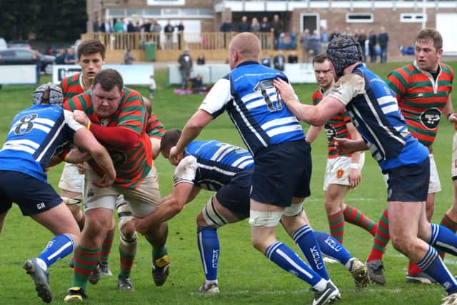 Ollie Cole tries to break the Kettering line EMN-140704-085045001