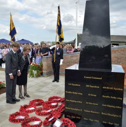 Janet Stubbs and her 13-year-old grandson Joseph lay a wreath at the memorial, which was unveiled at Strubby Airfield on Sunday.