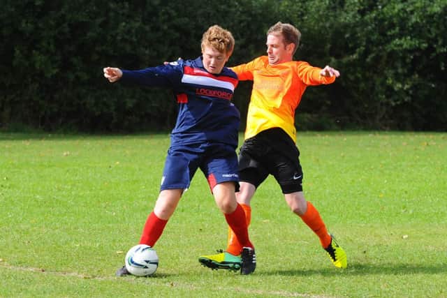 FC Hammers' Jace Snade and Friskney's Matthew Goy.
