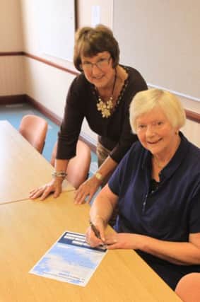 Councillor Doreen Stephenson, Leader of the Council, signs the tobacco declaration in the presence of Portfolio Holder for Communities, Councillor Sandra Harrison. EMN-141209-104748001