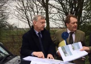 John Hayes looks over the Quadrant plans with David Newton.