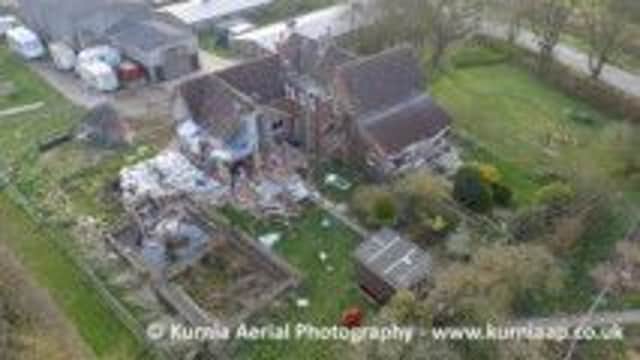 A view of Bleak Farm House after the explosion from the air EMN-150704-115122001