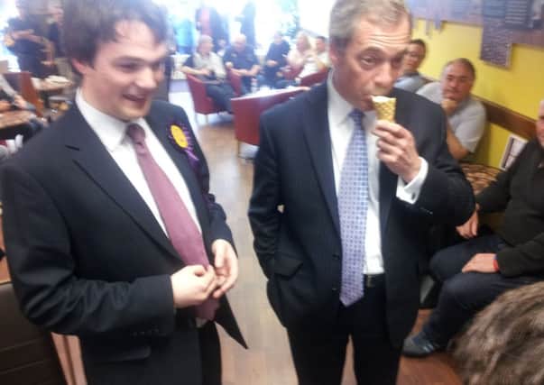 Nigel Farage tucks into an ice cream.