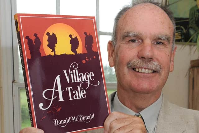 Book author Donald McDonald with his latest book. EMN-150906-171759001