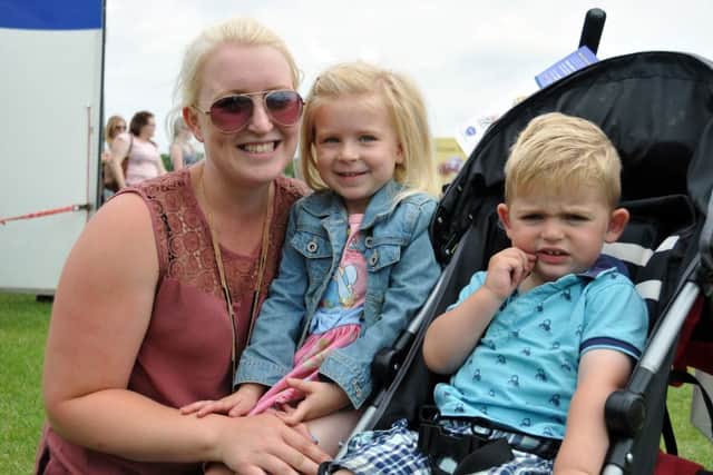 Louise, Kortina and Austin Beecham of Frieston enjoying Lincolnshire Show. SG250615-106TW ANL-150625-200538001