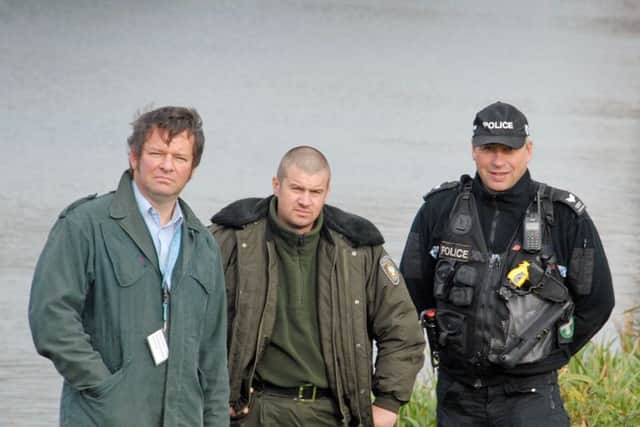 Adrian Saunders of the Environment Agency, Rafal Sosnowski from the Polish fishing authorities, Sergeant Dave Robinson of Lincolnshire Police carry out checks as part of Operation Traverse in Spalding. Photo by Tim Wilson