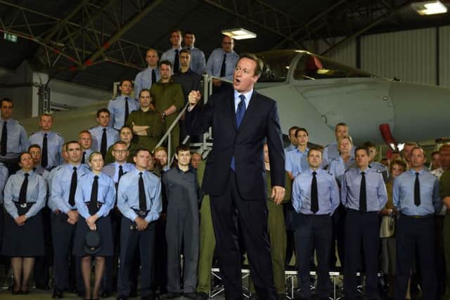 Prime Minister David Cameron addresses RAF airmen and officers during a visit to RAF Coningsby in Lincolnshire. PRESS ASSOCIATION Photo. Picture date: Monday July 13, 2015. See PA story DEFENCE Cameron. Photo credit should read: Joe Giddens/PA Wire EMN-150714-102113001