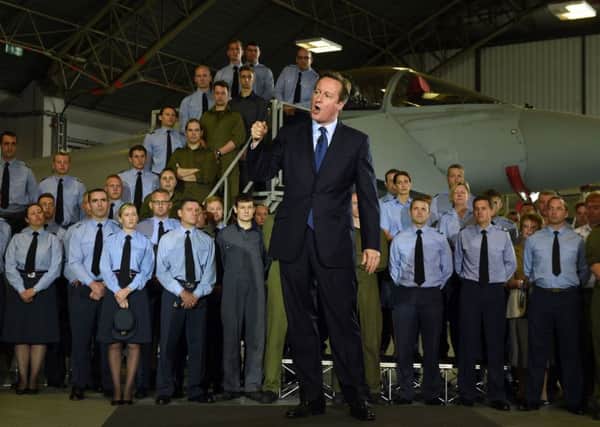 Prime Minister David Cameron addresses RAF airmen and officers during a visit to RAF Coningsby in Lincolnshire. PRESS ASSOCIATION Photo. Picture date: Monday July 13, 2015. See PA story DEFENCE Cameron. Photo credit should read: Joe Giddens/PA Wire EMN-150714-102113001