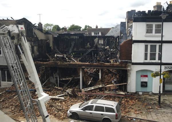 What's left of the Oxfam shop in Sudbury after a fire destroyed the building