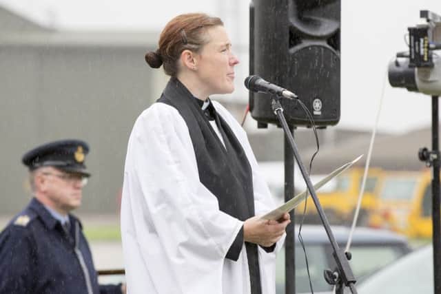 Padre Rachel Cook says a prayer during the Battle of Britain Service of Remembrance at RAF Coningsby. 15th September is Battle of Britain Day with 2015 being the 75th anniversary. CON-OFFICIAL-20140501-587