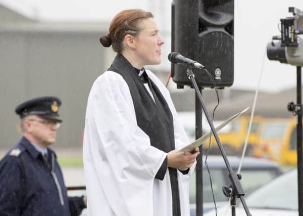 Padre Rachel Cook says a prayer during the Battle of Britain Service of Remembrance at RAF Coningsby. 15th September is Battle of Britain Day with 2015 being the 75th anniversary. CON-OFFICIAL-20140501-587