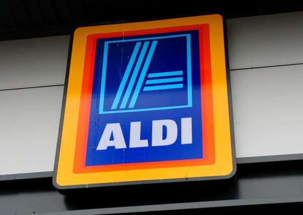 Aldi supermarket logo, as the discount retailer has reported a fall in profits as the supermarket price war took its toll on earnings despite sales surging to a new record level.  Photo: Rui Vieira/PA Wire