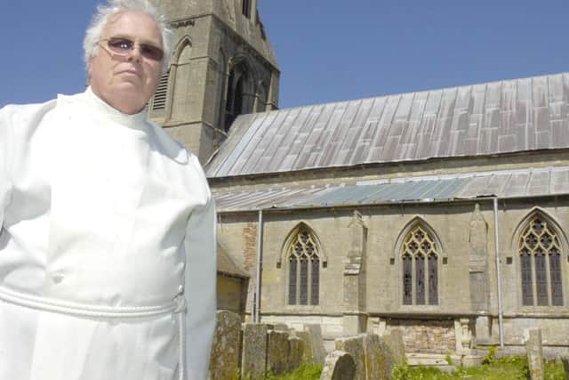Rev Charles Sowden outside Frampton St Mary's Chruch which has had lead stolen from the roof. ENGEMN00120110205141942
