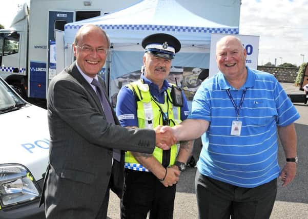 Lincolnshire Police and Crime Commissioner Alan Hardwick meets PCSO Colin Abbotts and volunteer Clarke Converse at a community engagement roadshow near Spalding.  Photo by Tim Wilson.