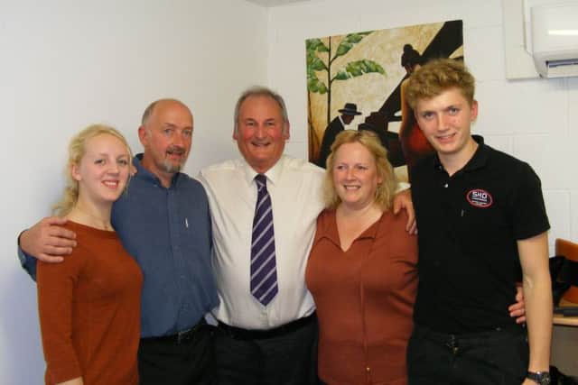 Richard Noble (centre) with Steve and Helen Doughty and family at SHD in Sleaford. EMN-151010-122949001