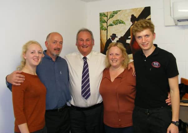 Richard Noble (centre) with Steve and Helen Doughty and family at SHD in Sleaford. EMN-151010-122949001
