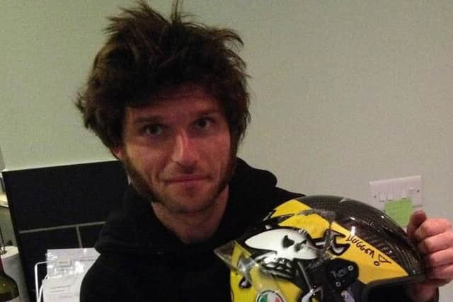 Guy Martin with the helmet he has donated to The Firefighters Charity EMN-151029-120500001