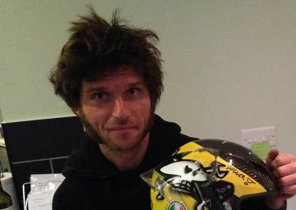 Guy Martin with the helmet he has donated to The Firefighters Charity EMN-151029-120500001