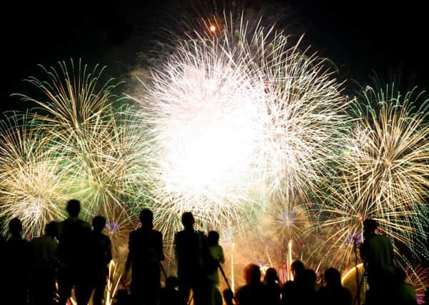 Spectators at a fireworks display - credit Shutterstock