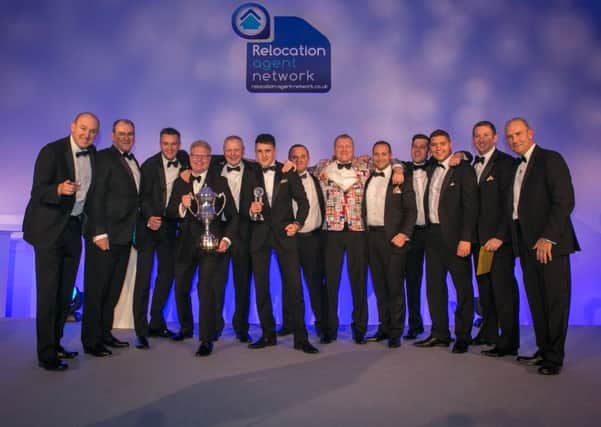 Pygott & Crone celebrating winning the Relocation Agent Network's Agent of the Year award.