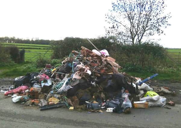 A huge pile of household and building waste was discovered dumped in Little Lawford Lane NNL-151117-130307001