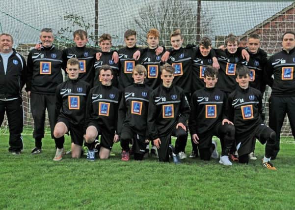 Louth Town Under 16s with new training tops from sponsors Aldi EMN-150312-152533002
