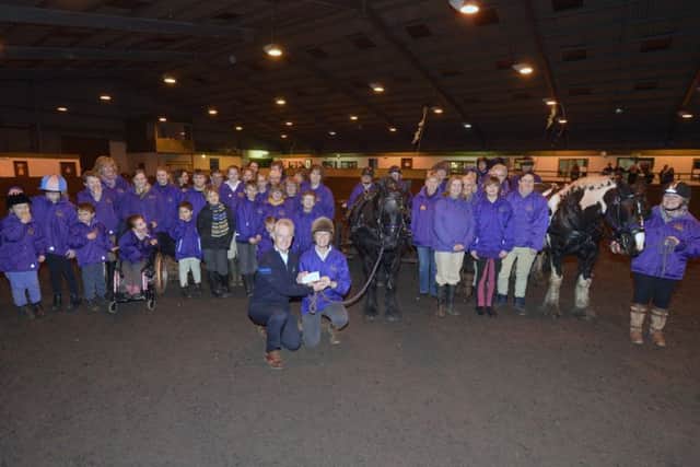 Steve Blackburn, Kenwick Park GC club captain for 2015 hands over cheque to Lincolnshire Wolds RDA committee member Caroline Sanderson EMN-150712-150554002