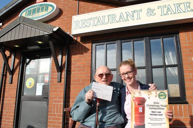 The Elite Fish & Chip Company's Rachel Tweedale with Arthur Harrison, the winner of the 2014 Elite Christmas Wish
