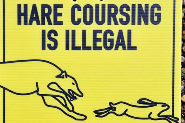 Signs warning off hare coursers
