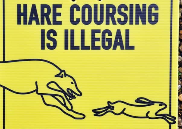 Signs warning off hare coursers