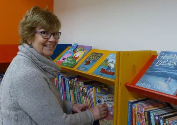 Volunteer Janet Toynton getting ready for the opening of the new library in Spilsby. ANL-161101-163231001