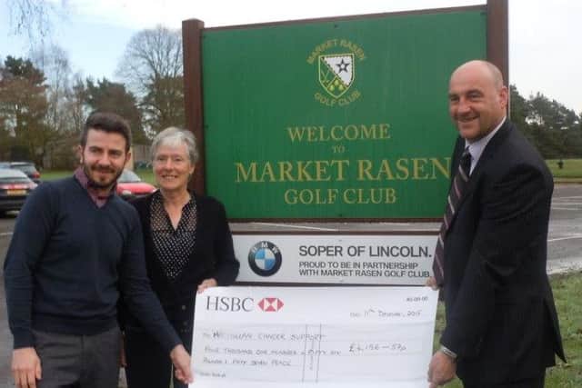 Market Rasen Golf Club men's captain Guy Hardcastle (right) and ladies' captain Hefina Brumpton with Jamie Davenport of Macmillan Cancer Care EMN-161101-162007002