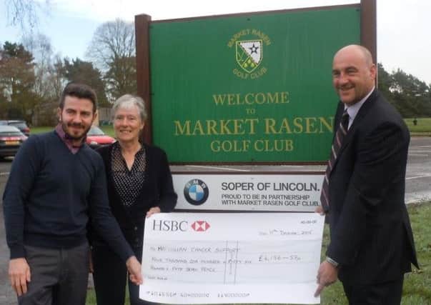 Market Rasen Golf Club men's captain Guy Hardcastle (right) and ladies' captain Hefina Brumpton with Jamie Davenport of Macmillan Cancer Care EMN-161101-162007002
