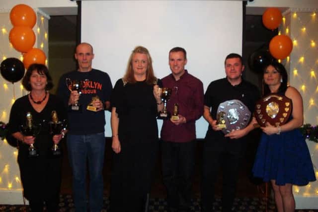 The prizewinners line up.