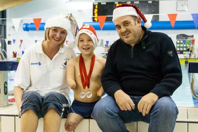 Harvey with coach Sarah and dad Darren Phillips EMN-160701-170348002